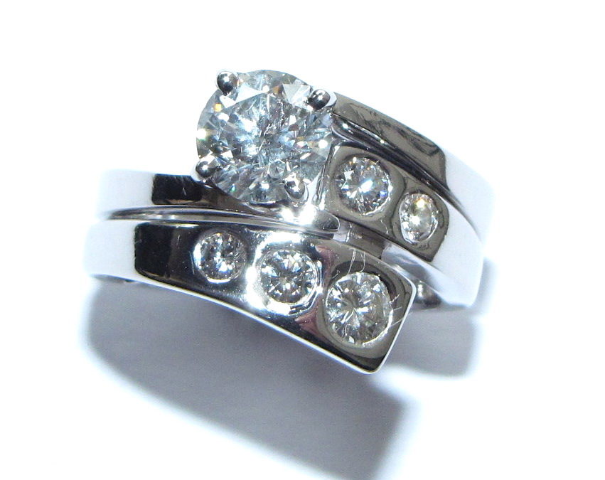 Fitted wedding ring with gypsy set diamonds